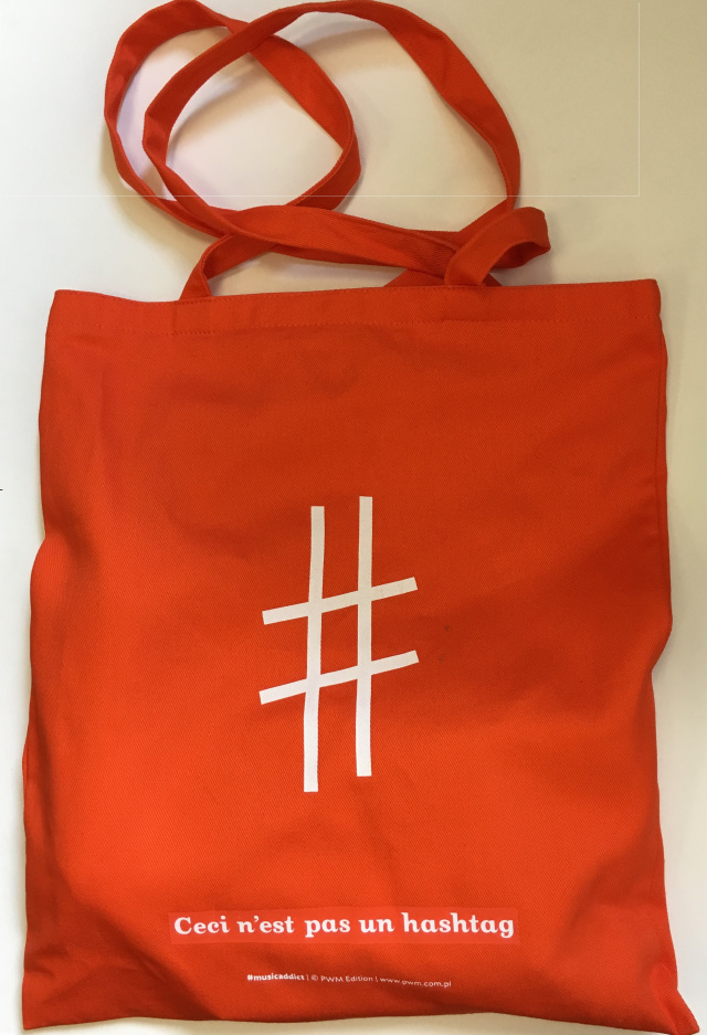 Red tote bag with a musical sharp symbol